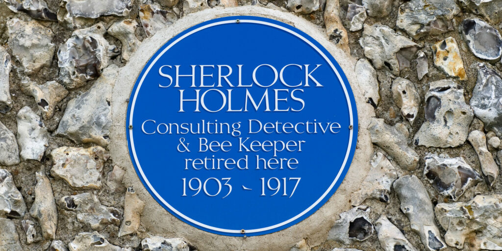 Sherlock Holmes blue plaque East Dean village near Eastbourne East Sussex. UK HOMER SYKES