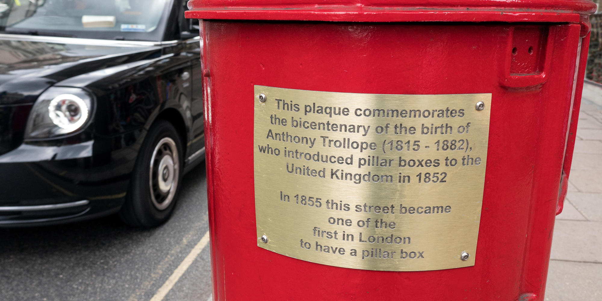 A plaque that commemorates the introduction of the pillar box by Anthony Trollope in 1852 Piccadilly London UK