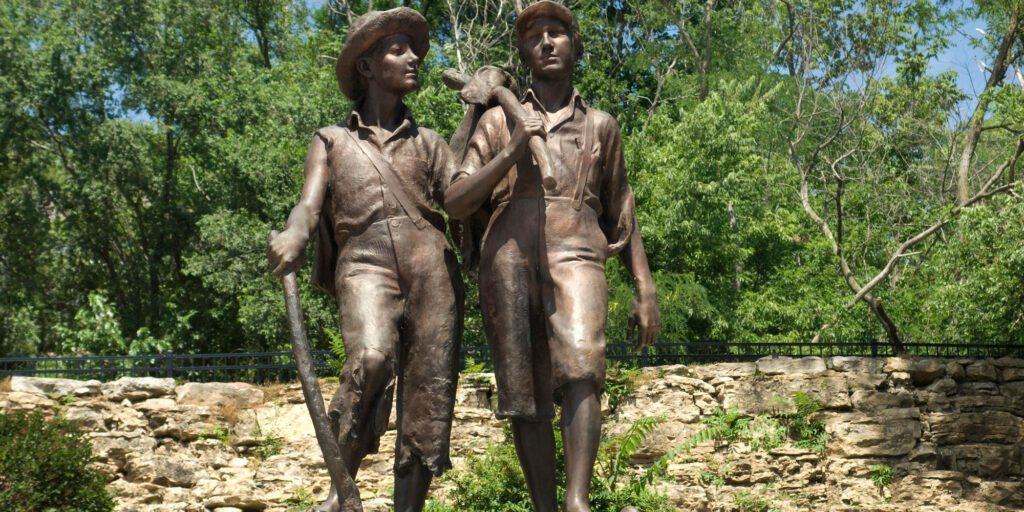 Huck Finn and Tom Sawyer statue near Mark Twain's boyhood home, Hannibal, Missouri. Digital photograph