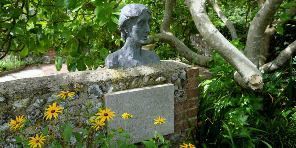 Virginia Woolf sculpture in the garden at her home Monks House at Rodmell in East Sussex England UK