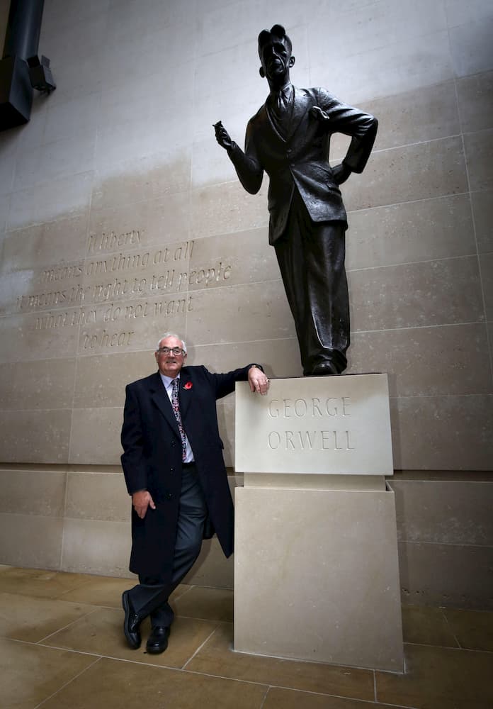 Richard Blair, Orwell's adopted son, with the statue of his father